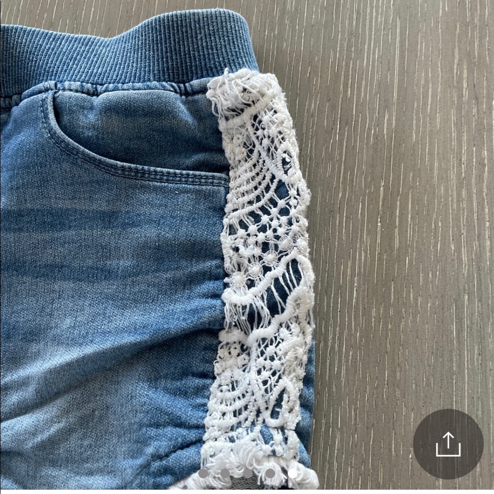 Adorable Hudson Denim Shorts with macrame along the sides and bottom hem.